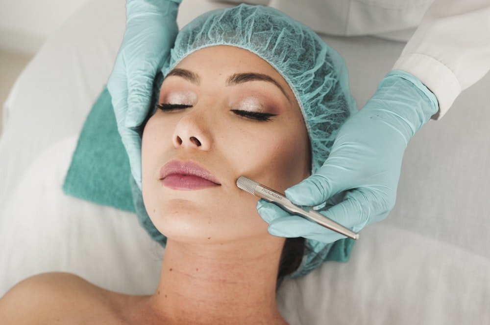 Woman receiving a facial wellness treatment